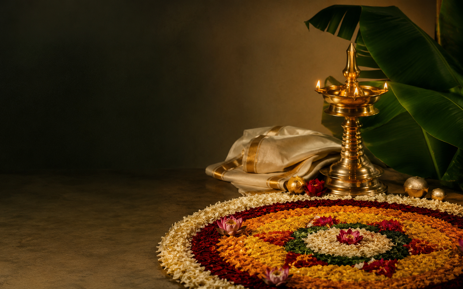Premium Onam celebration with pookalam, brass nilavilakku, kasavu and banana leaves